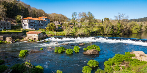 A Ponte Maceira, Galicia, Spain - April 4, 2023: River Tambre running through the village