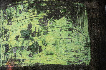 Green paint on black metal pole grunge texture