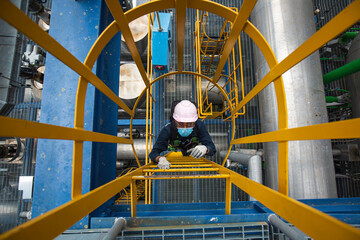 Male  top view climb the stairway scaffolding inspection pipeline