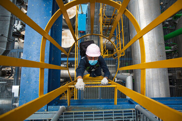 Male  top view climb the stairway scaffolding inspection pipeline