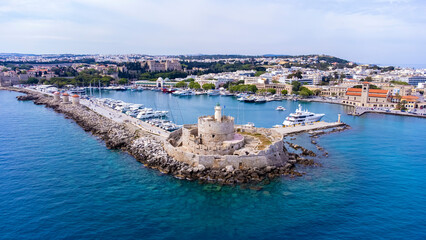 Mandraki port of Rhodes city harbor and Elli beach a popular summer tourist destination, aerial...