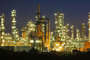 Twilight scene of tank oil refinery plant and tower column of Petrochemistry