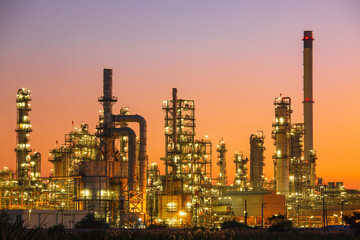Plakat Oil​ refinery​ and​ plant and tower column of Petrochemistry industry in oil​ and​ gas​ ​industrial with​ cloud​ orange​ ​sky