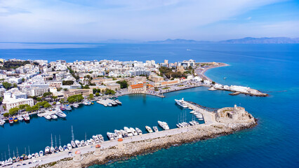Fototapeta na wymiar Mandraki port of Rhodes city harbor and Elli beach a popular summer tourist destination, aerial panoramic view in Rhodes island in Greece
