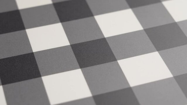 Checkered geometric table mat pattern close up. Rotation