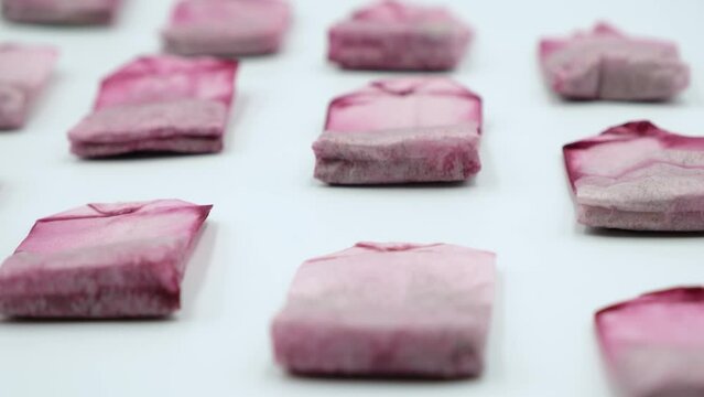 Used tea bags are dried in a row by the window sill. Compostable, Reusable or Trash
