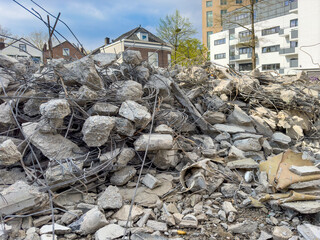 Demolition of buildings. Construction machinery at the construction site is engaged in the...