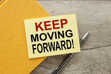 keep moving forward yellow sticker with text in black font