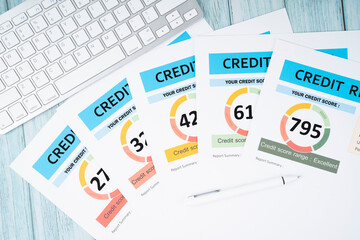 The Credit score report document and pen with computer keyboard on the desk.