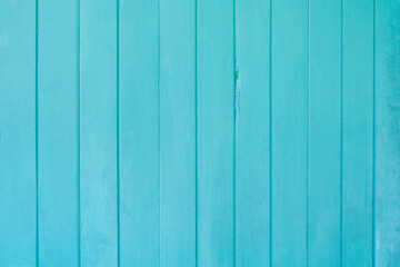 The Beautiful turquoise colored wooden background with vertical boards.