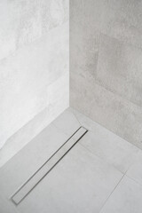 shower drainage system installed at contemporary bathroom interior