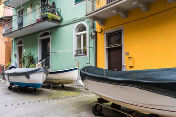 Fototapeta na wymiar Boats parked in the street at Manarola, a fisherman town in Cinque Terre