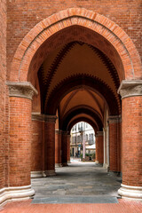 Brick walls and columns and voulted ceiling in town of Alba, Italy.