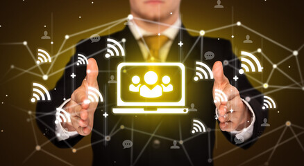 Hand holding social media icons