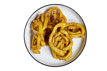 Griwech crunchy pastries , an Algerian dessert made with dough, fried and then coated with syrup and sesame seeds, in morocco named Chebakia isolated on white