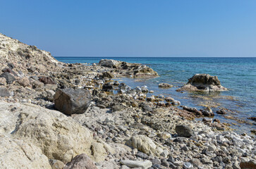Fototapeta na wymiar rocks ad reefs at low tide on Alacati coast near Gilikli Beach (Cesme, Izmir province, Turkey) 