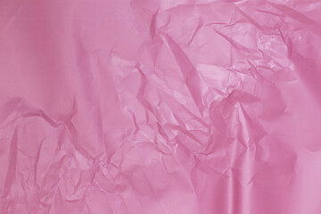 Naklejka premium background by pink crumpled paper