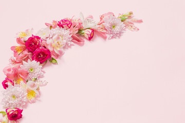 alstroemeriaand chrysanthemums flowers on pink background