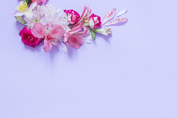 Fototapeta na wymiar alstroemeriaand chrysanthemums flowers on violet background