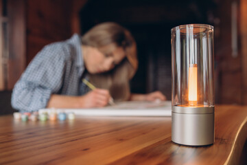 Painting For Beginners. Young black woman drawing picture by numbers with acrylic paints on canvas, enjoying creative leisure activities