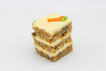Simple Multilayered Square Slice of Carrot Cake on a White Background