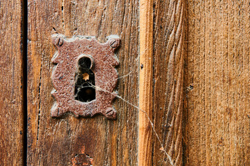 old lock on an old wooden door