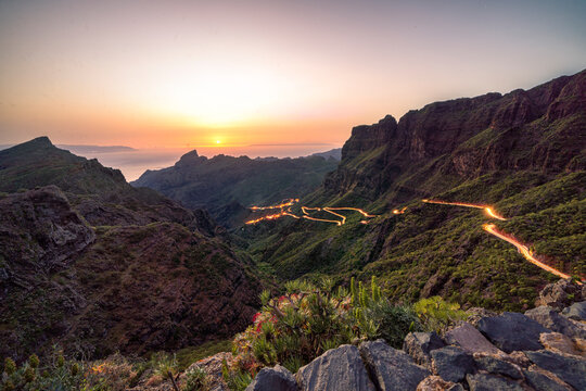 Golden hour sunset image of winding road leading to the village of Masca in dramatic landscape on Tenerife, Spain