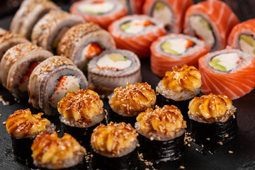 Rolls set with fish shrimp and caviar sushi with chopsticks - asian food and japanese cuisine concept