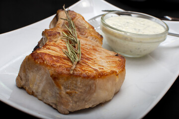 Pork steak with rosemary and white sauce