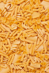 Heap of different type of pasta texture background