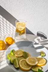 glass of lemonade with lemon in the jar