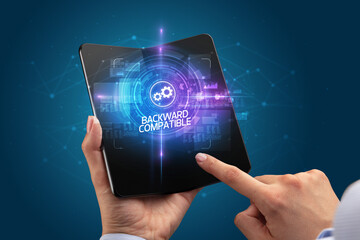 Businessman holding a foldable smartphone, technology concept