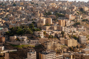 Fototapeta na wymiar Citadel of Amman. Ancient Philadelphia or Amman Capital of Jordan.View of city from height of hill on which citadel is located. City on hills. Amman, Jordan, December 2, 2009
