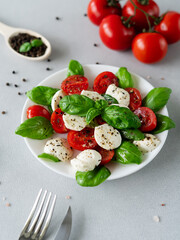 Salad Caprese with tomato, mozzarella and basil. Italian food