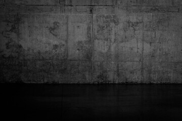 Grungy dark concrete wall and wet floor