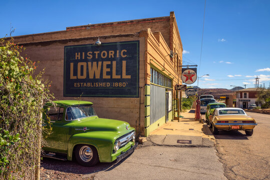 Lowell, Arizona, USA - October 17, 2018 : Historic Erie street with a vintage 1956 Ford F-100 car in Lowell. This ghost town situated on the other side of the Lavender Pit Mine is now part of Bisbee.