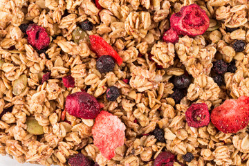 Muesli oat cereals close up background with dry fruits - 598679373