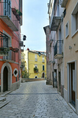 A narrow street among the old houses of Guardia Sanframondi, a small town of Benevento province, Italy.