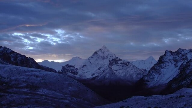 Ama Dablam Himalaya mountain with other peaks, 2023
Beautiful dramatic purple and blue cloudy sunset over snow covered,2023 

