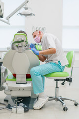 the patient at the dentist's appointment complains of toothache and caries the doctor advises her before the examination