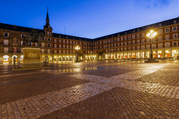 Fototapeta na wymiar Madrid, Spain 08-06-2021 the beautiful and vibrant plaza mayor in the heart of Madrid during blue hour. The place where you can experience the real Spanish culture and to enjoy a typical bocadillo