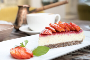 Piece of delicious cheesecake with berries on table close up