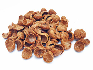 Chocolate cereals pile isolated on white background. Heap of sweet brown choco cereals, corn flakes for breakfast or healthy snack. Quick chocolate breakfast for kids.