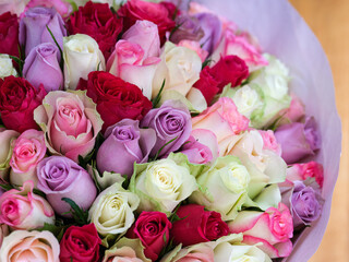 A close-up of a big bouquet of beautiful multicolored roses.