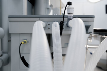 tubes from the artificial respiration apparatus in the operating room the beginning of a surgical operation in the hospital