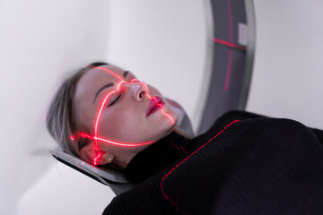 The patient undergoes computer tomography in the hospital scanner high-tech equipment and...