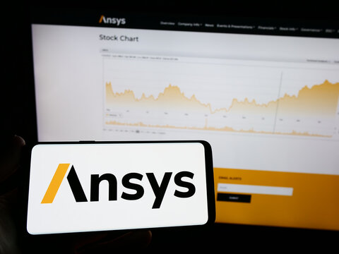 Stuttgart, Germany - 04-27-2023: Person holding mobile phone with logo of American simulation software company Ansys Inc. on screen in front of web page. Focus on phone display.