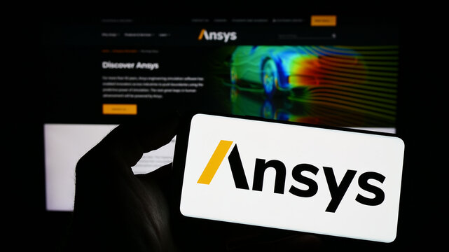 Stuttgart, Germany - 04-27-2023: Person holding smartphone with logo of US simulation software company Ansys Inc. on screen in front of website. Focus on phone display.