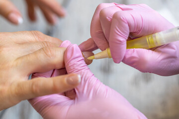 Nails manicure detail with file or brush item. Woman beautiful nail care process.