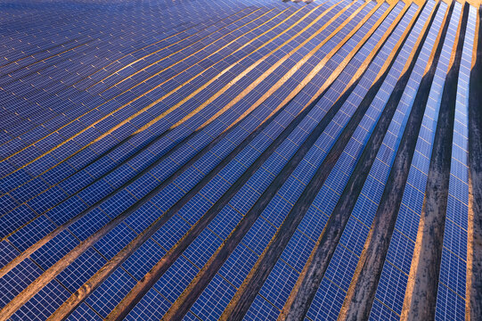 View from above of a large Solar Power Station with sunlight on the solar panels producing electricity sustainable energy at sunset, Renewable Energy, Solar Energy, Spain